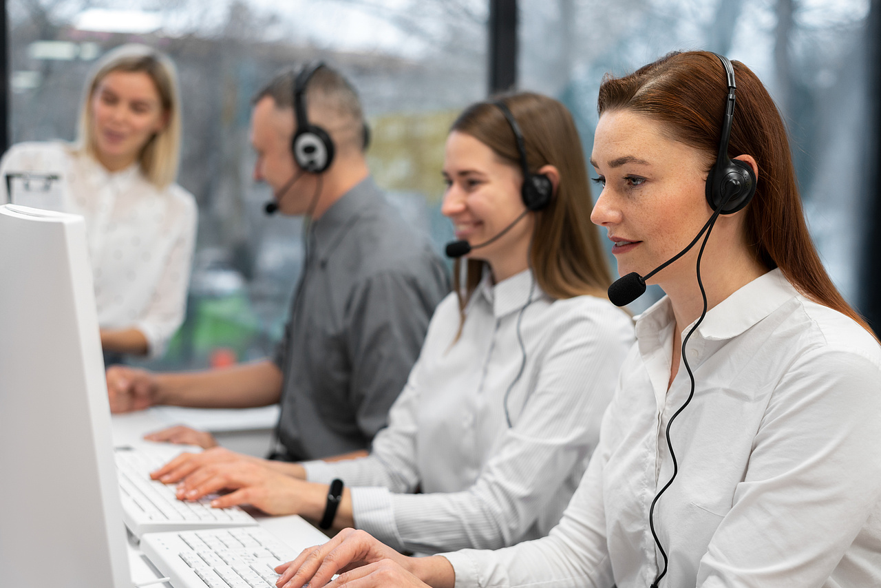 Business meeting with a man and woman discussing something on a tablet
